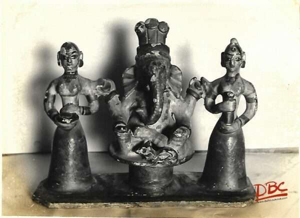 Ganeshna surrounded by two female terracotta