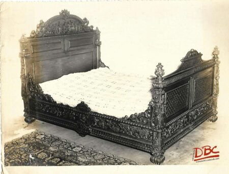 A Large Double bed Showing of the Ride Wooden Carving of the Bed