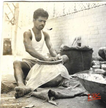 Position of Craftsman While Sieving The Clay