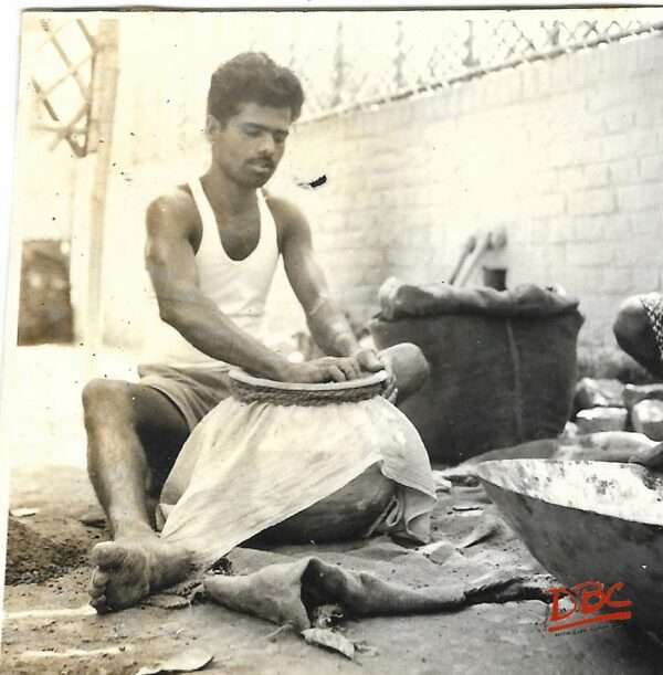 Position of Craftsman While Sieving The Clay