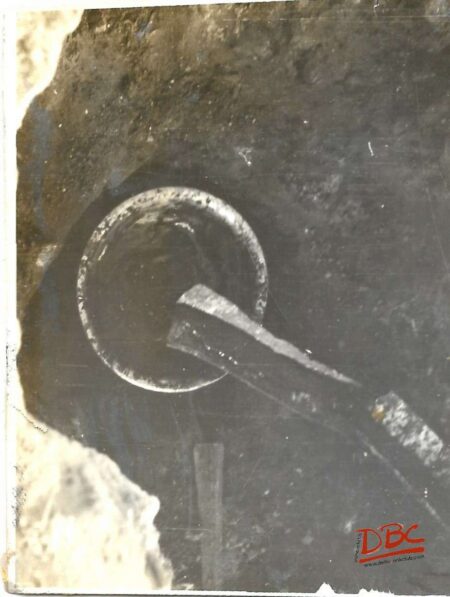 The Molten Wax Being Collected in a Pan Filled With Water Placed in the Pit