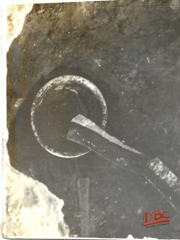 The Molten Wax Being Collected in a Pan Filled With Water Placed in the Pit