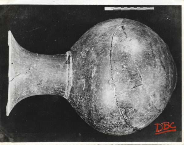 Burzhom (D. G. A.) High Necked Jar with a splayed out Rain in Black Polished Ware