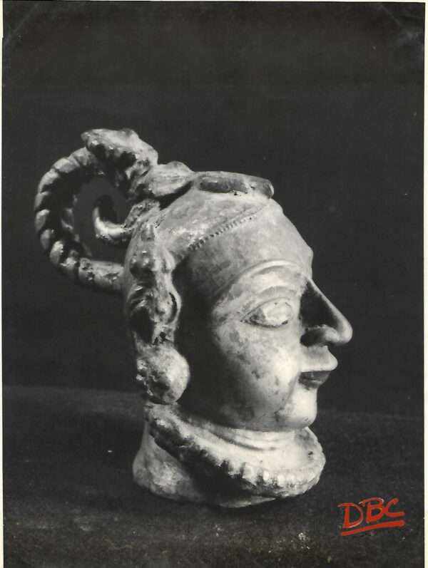 Brass head of a figure