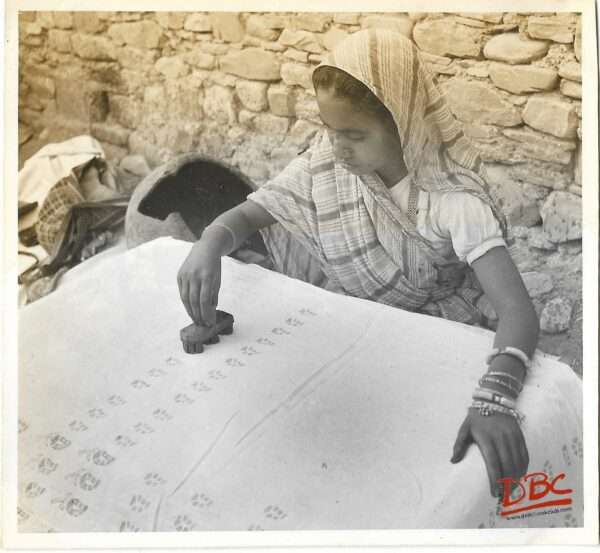 BLOCK PRINTING ON A WHITE TEXTILE PIECE