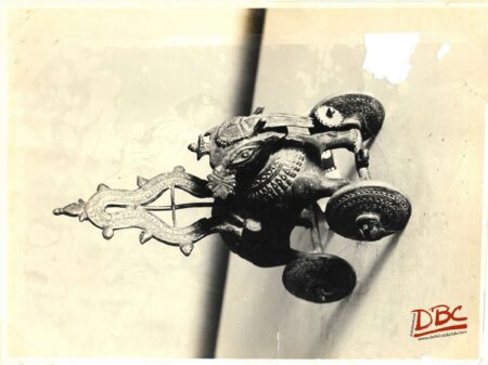 toy decosative elephant with four wheels