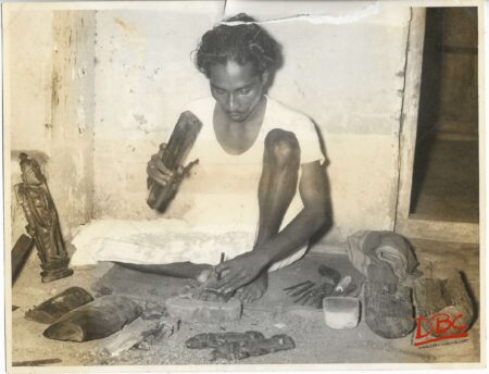A Craftsman Prepaing Wooden Fig.
