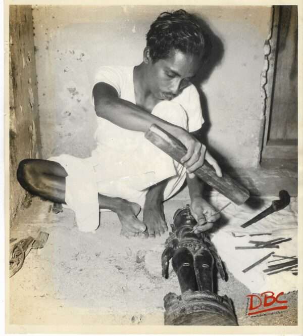 A Craftsman Prepaing Wooden Fig.