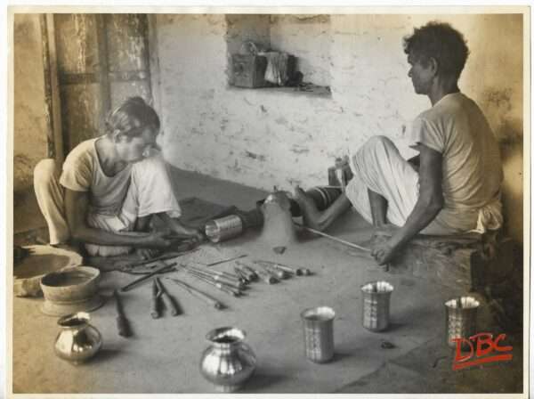 Two Craftsman Working on Bras Utensils