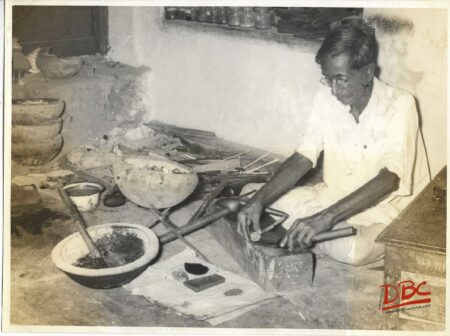 A Craftsman Working With His Tools