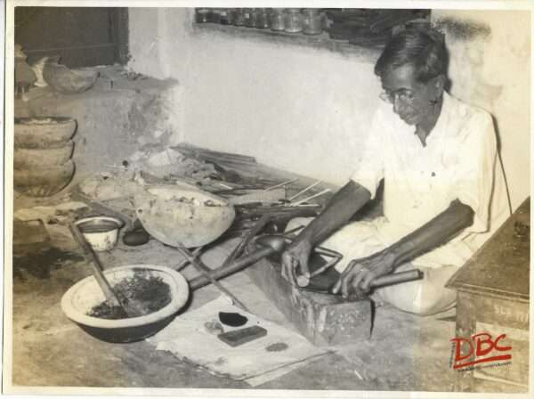 A Craftsman Working With His Tools