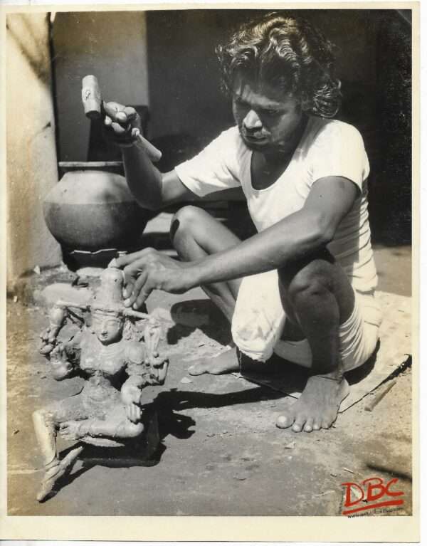 A Craftsman Working on a Figure cire Perdue Casting