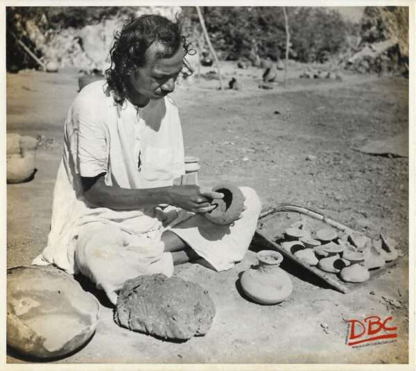 A Craftsman Preparing Clay Models for Casting