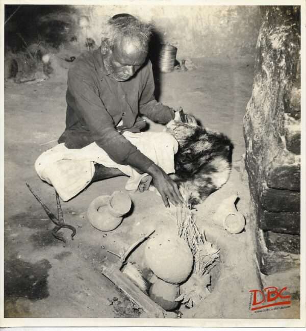 A Craftsman Working With His Tools