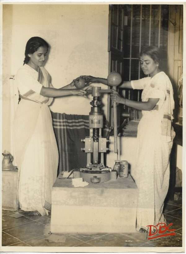 Two Ladies Working on Macine