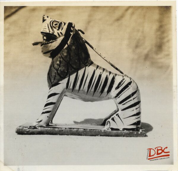 A Wooden Lion In Sitting Pose