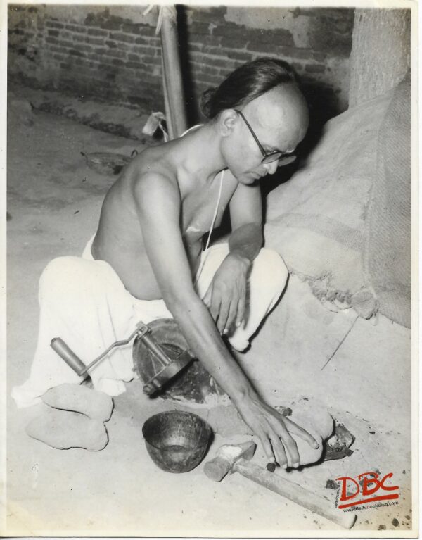 A Craftsman Preparing A Clay Animal Figure